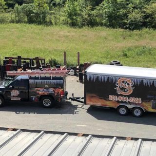 Aerial view of the Sisco Heat & Air truck and trailer